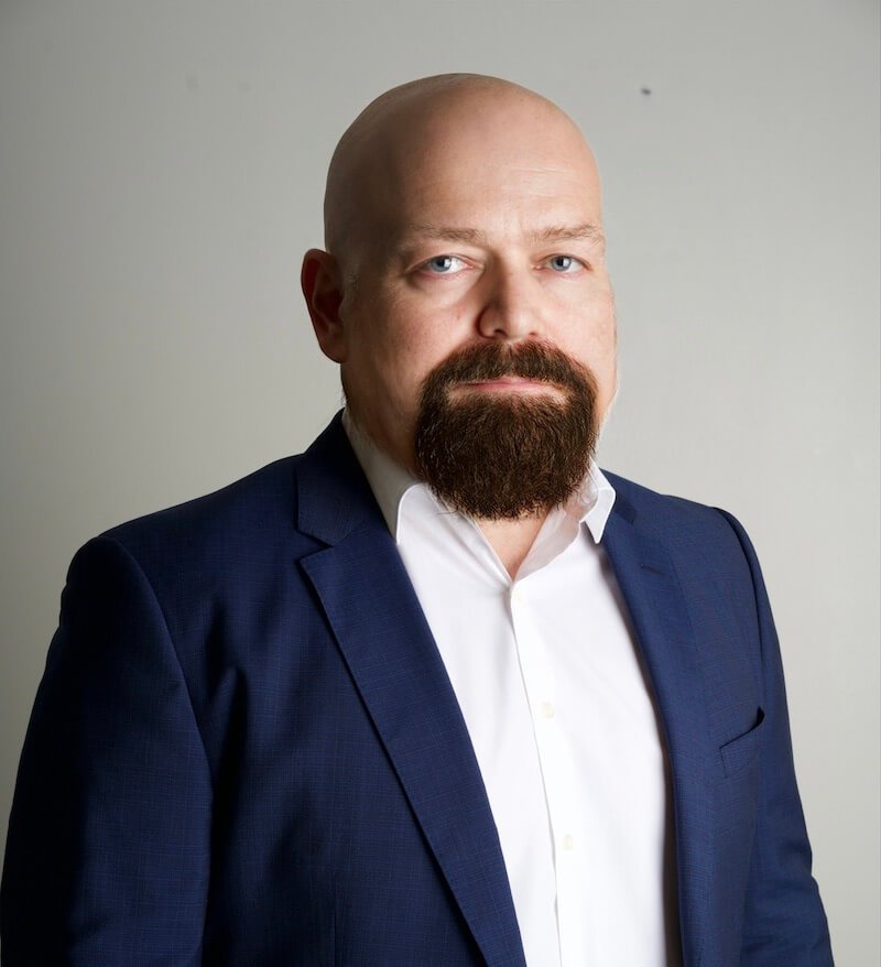 Gene Avakyan wearing a blue suit